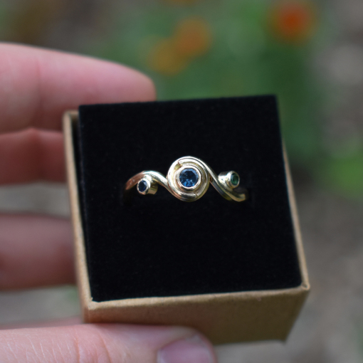 A photo of a nontraditional wedding ring in a jewelry box